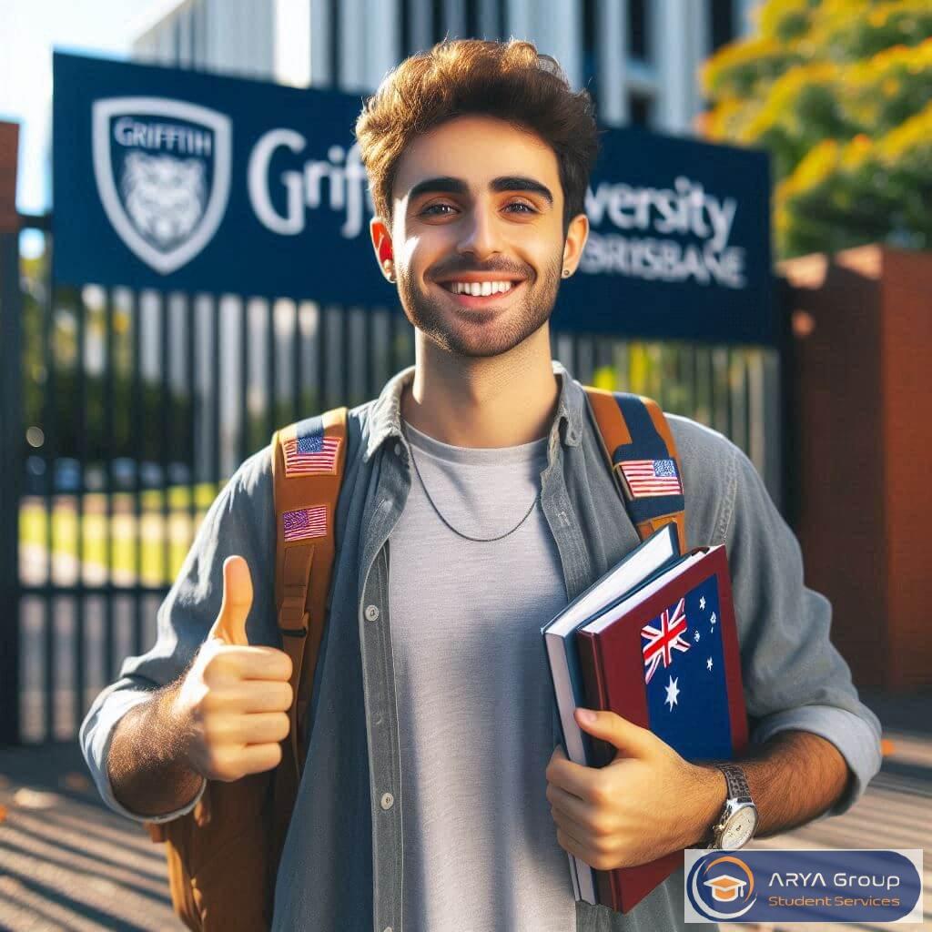 دانشجوی ایرانی با لبخند و ژست لایک جلوی تابلو Griffith University در بریزبن